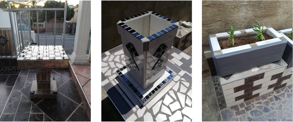 Jay's sculptures in cement and tile. Includes a chess table, a vase, and a planter